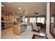 Open floor plan featuring a spacious living room and kitchen with bar seating at 20669 N 266Th Ave, Buckeye, AZ 85396