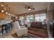 A beautifully appointed living room featuring comfortable seating, a ceiling fan and bright natural light at 20669 N 266Th Ave, Buckeye, AZ 85396