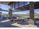 Enjoy the outdoors with covered patio, golf course views, and comfortable seating for relaxing and entertaining at 20669 N 266Th Ave, Buckeye, AZ 85396