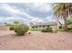 Private backyard featuring a pool, lush landscaping, and a spacious patio at 2502 S Mollera Cir, Mesa, AZ 85210