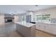 Bright kitchen features stainless steel appliances, center island, and view to the backyard at 2502 S Mollera Cir, Mesa, AZ 85210