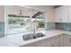 Kitchen sink with backyard pool view at 2502 S Mollera Cir, Mesa, AZ 85210