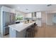 Modern kitchen with stainless steel appliances, a large island, white cabinets, and bright countertops at 2502 S Mollera Cir, Mesa, AZ 85210
