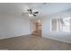 Spacious living room features stylish floors, neutral walls and a ceiling fan with an attached light at 2502 S Mollera Cir, Mesa, AZ 85210