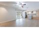 Bright, open-concept living room with sliding doors to backyard and a view into the modern kitchen at 2502 S Mollera Cir, Mesa, AZ 85210
