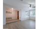 Open-concept living room with new floors, light colored walls and a beautiful view from a large window at 2502 S Mollera Cir, Mesa, AZ 85210