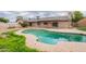 Sparkling pool in backyard oasis with mature trees and landscaping at 2502 S Mollera Cir, Mesa, AZ 85210
