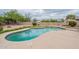 The beautiful private pool is surrounded by well kept landscaping at 2502 S Mollera Cir, Mesa, AZ 85210