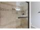 Shower features mosaic accents, glass door, showerhead and built-in seat at 2502 S Mollera Cir, Mesa, AZ 85210