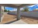View of backyard with desert landscaping and covered patio at 2506 N Pony Ln, Casa Grande, AZ 85122