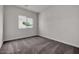 This bedroom features neutral walls, carpet flooring, a window, and electrical outlets at 2506 N Pony Ln, Casa Grande, AZ 85122