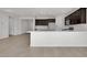 Spacious kitchen with a large island, dark wood cabinets, and stainless steel appliances at 2506 N Pony Ln, Casa Grande, AZ 85122