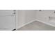 Laundry Room with tiled floors and new white door at 2506 N Pony Ln, Casa Grande, AZ 85122