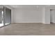 Spacious living room with tile flooring and a sliding glass door at 2506 N Pony Ln, Casa Grande, AZ 85122