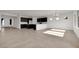 Open-concept living space featuring tile floors, dark cabinets, and lots of natural light at 2506 N Pony Ln, Casa Grande, AZ 85122