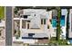 Aerial view of a luxury home with a gray roof, pool, outdoor seating, and well-manicured landscaping at 2735 E King Bird Dr, Gilbert, AZ 85297