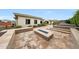The backyard features a fire pit and manicured landscaping, ideal for outdoor entertainment and relaxation at 2735 E King Bird Dr, Gilbert, AZ 85297