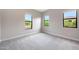Comfortable bedroom with soft carpet and bright windows offering scenic outdoor views at 2735 E King Bird Dr, Gilbert, AZ 85297