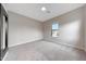 Cozy bedroom with soft carpet flooring, a window, and a large wall mirror at 2735 E King Bird Dr, Gilbert, AZ 85297