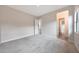 Spacious carpeted bedroom with an en suite bathroom, closet, and access to other rooms at 2735 E King Bird Dr, Gilbert, AZ 85297