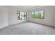 Brightly lit carpeted bedroom with an en suite bathroom and a large window for natural light at 2735 E King Bird Dr, Gilbert, AZ 85297