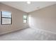 Carpeted bedroom with two windows allowing natural light and a view of the outside at 2735 E King Bird Dr, Gilbert, AZ 85297