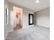Bright bedroom with an entrance to a bathroom and a large wall mirror at 2735 E King Bird Dr, Gilbert, AZ 85297