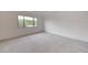 Bright bedroom with a neutral carpet, recessed lights, and a large window that lets in plenty of natural light at 2735 E King Bird Dr, Gilbert, AZ 85297