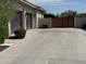 Wide driveway leading to garages and a private gate, offering convenient and secure parking at 2735 E King Bird Dr, Gilbert, AZ 85297