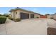 Large three car garage with automatic doors and spacious driveway at 2735 E King Bird Dr, Gilbert, AZ 85297