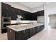 Modern kitchen with stainless steel appliances, granite countertops, and a large center island at 2735 E King Bird Dr, Gilbert, AZ 85297