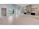 Large living area with tile floors, high ceilings, and a modern fireplace at 2735 E King Bird Dr, Gilbert, AZ 85297
