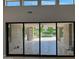 Bright Living Room With Large Sliding Doors that Provide Plenty of Natural Light and Access to the Outdoor Pool at 2735 E King Bird Dr, Gilbert, AZ 85297
