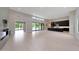 A spacious living room with a modern fireplace, plenty of natural light, and high ceilings at 2735 E King Bird Dr, Gilbert, AZ 85297
