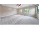 Spacious carpeted main bedroom featuring several windows and a modern ceiling fan at 2735 E King Bird Dr, Gilbert, AZ 85297