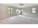 Spacious carpeted main bedroom featuring several windows and a modern ceiling fan at 2735 E King Bird Dr, Gilbert, AZ 85297