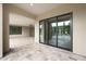 Covered patio featuring tile flooring, offers easy access to the home's interior through sliding glass doors at 2735 E King Bird Dr, Gilbert, AZ 85297