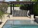 Outdoor kitchen and bar with a built-in grill, perfect for entertaining by the pool at 2735 E King Bird Dr, Gilbert, AZ 85297