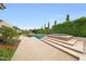 This backyard offers a pool with a spa, beautiful plants, and an outdoor living area for entertaining or relaxing at 2735 E King Bird Dr, Gilbert, AZ 85297