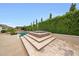 Backyard view showcasing a sparkling pool, covered hot tub, and lush landscaping for a serene outdoor experience at 2735 E King Bird Dr, Gilbert, AZ 85297
