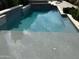 Refreshing in-ground pool with a beach entry and modern stone surround at 2735 E King Bird Dr, Gilbert, AZ 85297