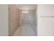 Detailed view of glass shower with bench, gray tile surround, and chrome shower head and fixtures at 2735 E King Bird Dr, Gilbert, AZ 85297