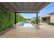 Backyard swimming pool with manicured privacy landscaping and a view of the modern home at 2735 E King Bird Dr, Gilbert, AZ 85297