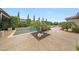 Swimming pool featuring mature landscaping and a small waterfall feature into the pool area at 2735 E King Bird Dr, Gilbert, AZ 85297
