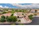 Stunning aerial view of a Gathering home featuring a well-manicured lawn, mature trees, and a sparkling swimming pool at 2851 E Alexander Ct, Gilbert, AZ 85298