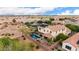 Aerial view of the home showcasing the backyard pool and patio with the neighborhood in the background at 2851 E Alexander Ct, Gilbert, AZ 85298