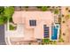 Aerial view of the roof featuring solar panels, backyard pool, spa, patio, and desert landscaping at 2851 E Alexander Ct, Gilbert, AZ 85298