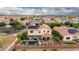Aerial view showcasing the backyard pool, outdoor patio, and solar panels in a residential neighborhood at 2851 E Alexander Ct, Gilbert, AZ 85298