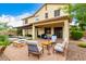 Charming backyard with a seating area near the firepit and view of the pool and home exterior at 2851 E Alexander Ct, Gilbert, AZ 85298
