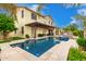 Amazing outdoor space features a refreshing swimming pool, covered patio, and manicured landscaping at 2851 E Alexander Ct, Gilbert, AZ 85298